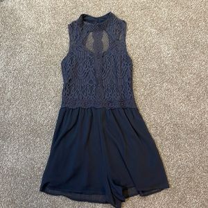 Grey romper with lace accent and open back